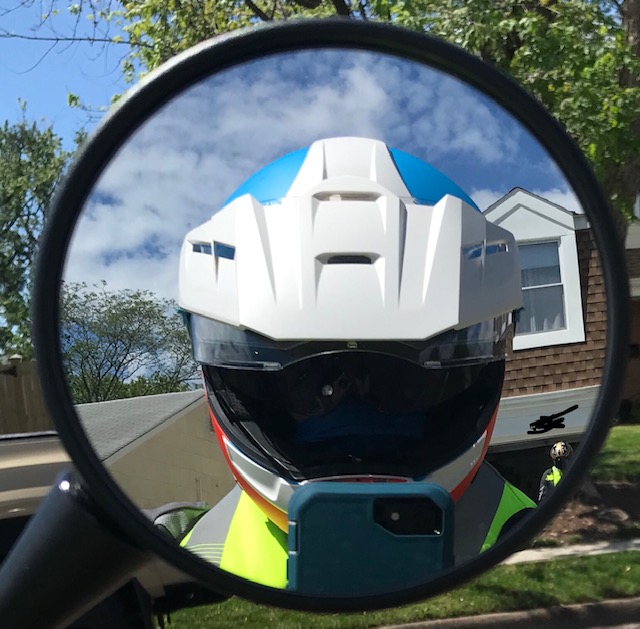 Author taking selfie in side mirror.