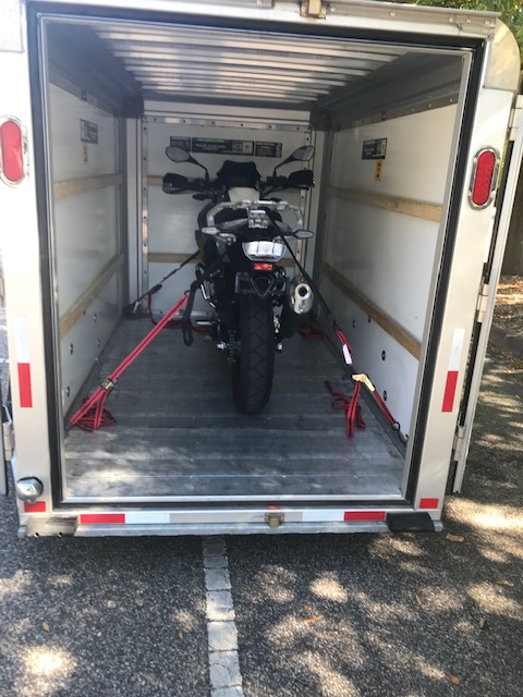 BMW G310 GS loaded onto a UHaul trailer.