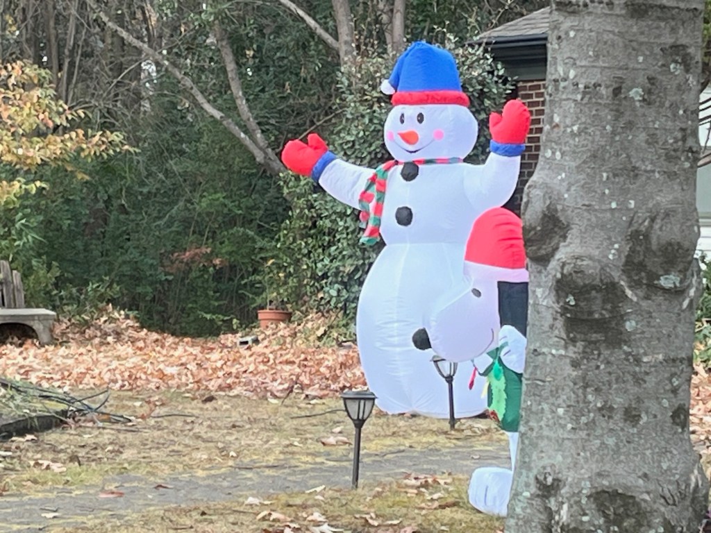 blow up snow man and Snoopy