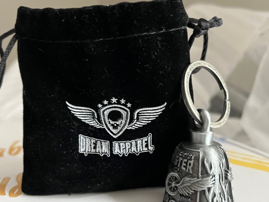 black bag and small gray bell