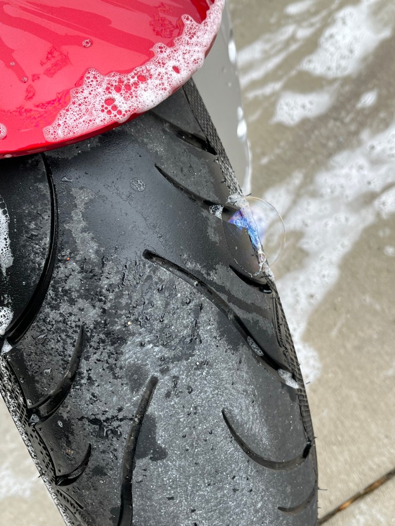 soap bubble on front tire of motorcycle